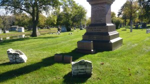 Stone chairs facing a tall monument